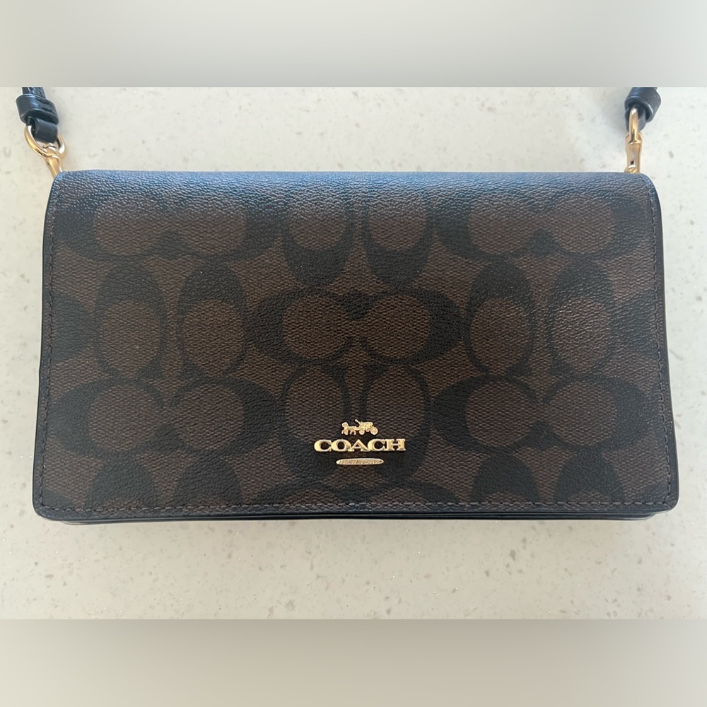COACH fold-over crossbody clutch. Brown/black with gold